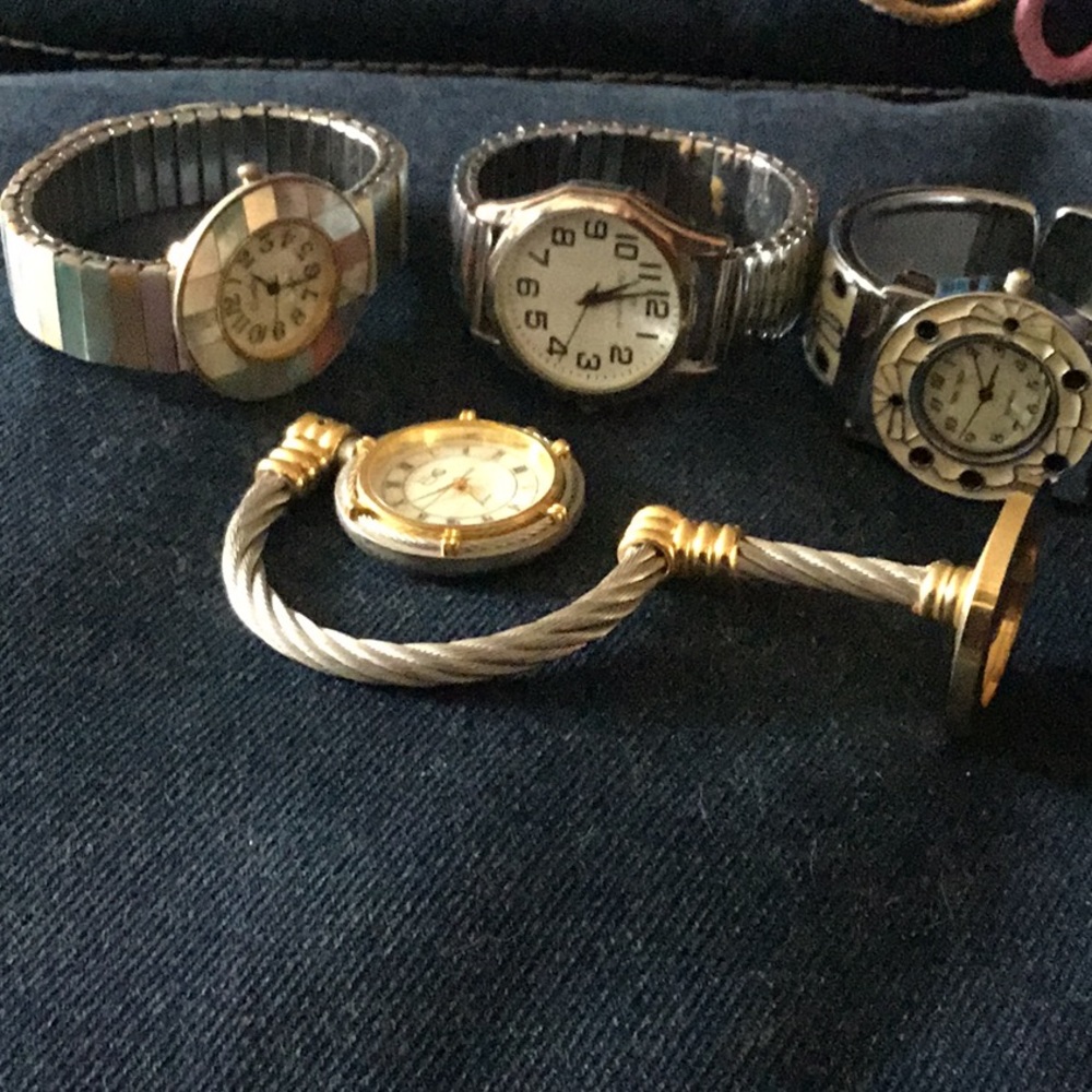 3 watches and a standing clock